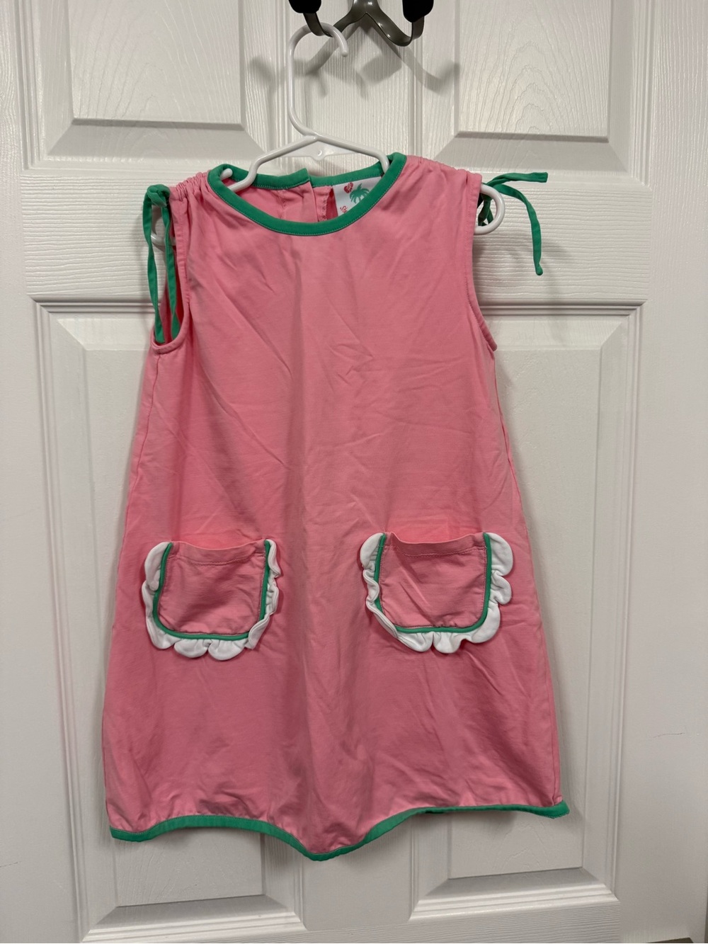 Kids Pink Sleeveless dress with green trim and scalloped pockets